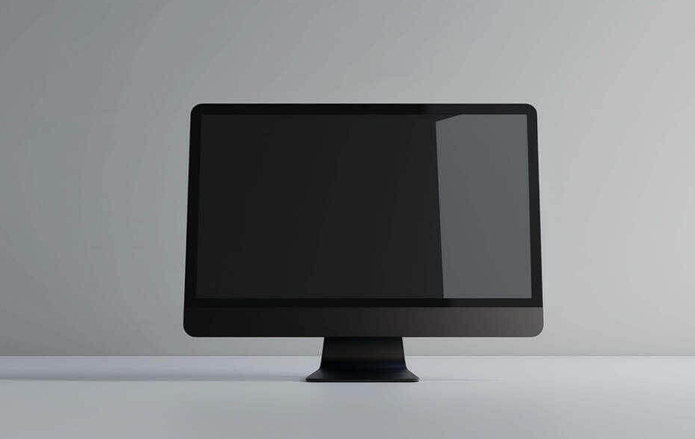 black computer monitor on white table