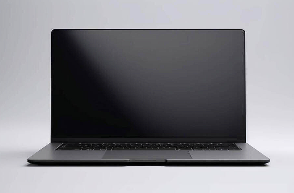 black laptop computer with empty screen on grey background