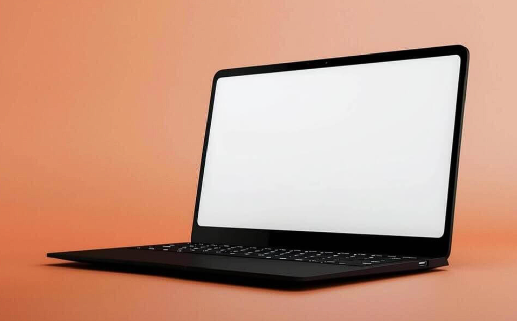 black laptop on orange background