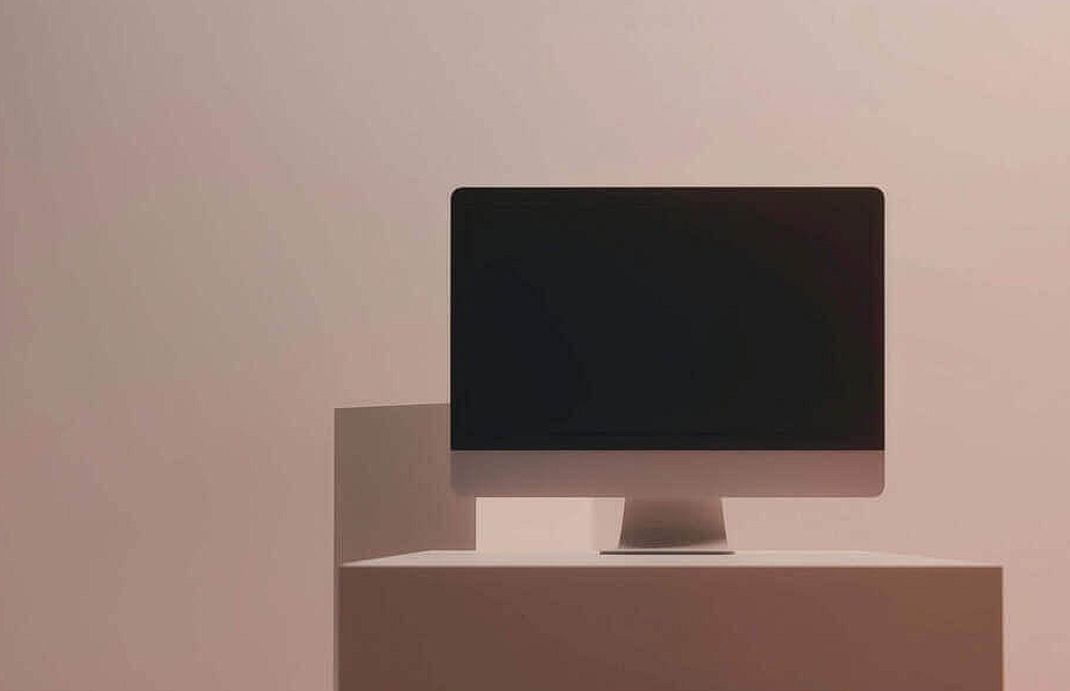 computer monitor on white cube