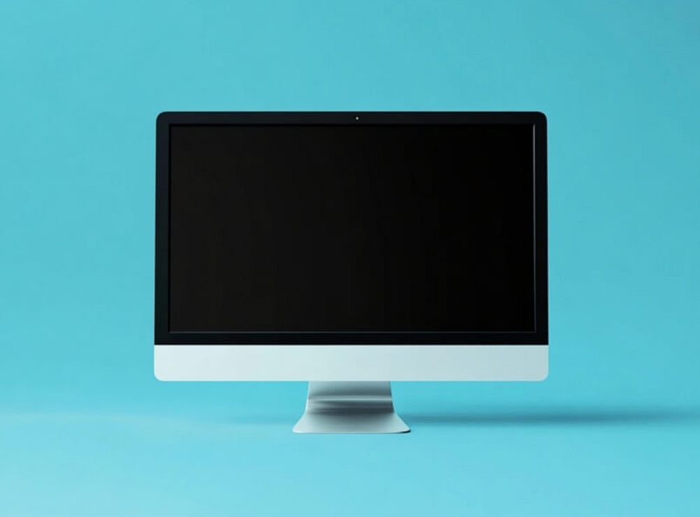 modern computer monitor on turquoise background