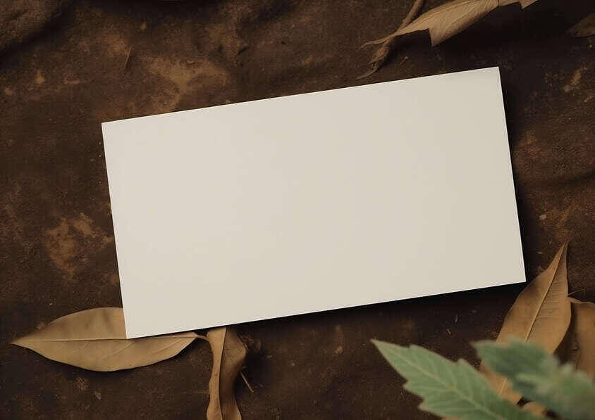Flyer Mockups blank white card on brown surface with leaves and branches