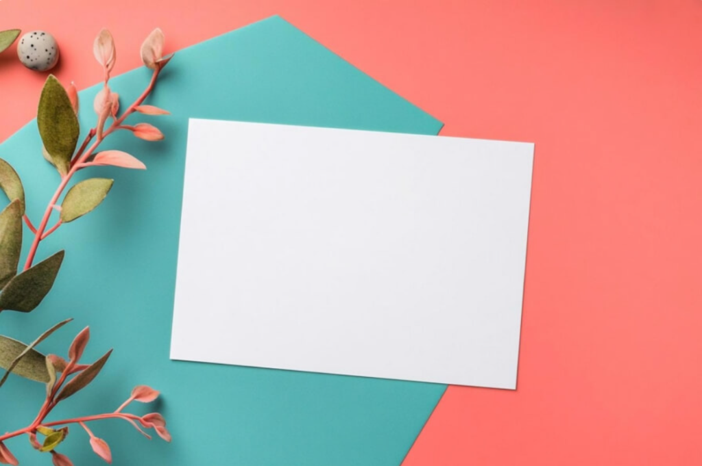 minimalist flat lay with blank paper and branch